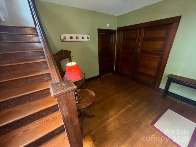 a view of entryway with wooden floor