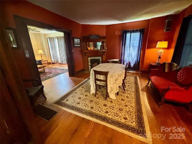 a living room with rug couches cushion and a window