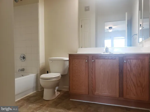 a bathroom with a toilet a sink and bathtub