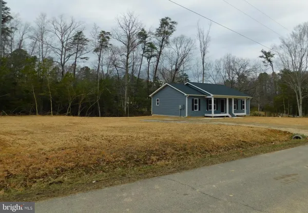a house with trees in the background