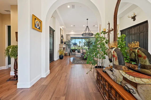 a living room with furniture ceiling fan and a rug