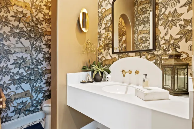 a bathroom with a white bath tub and a shower