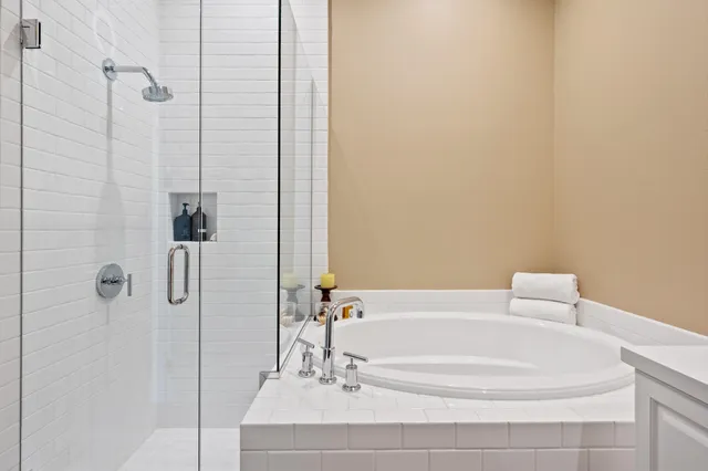 a dining room with furniture and a floor to ceiling window