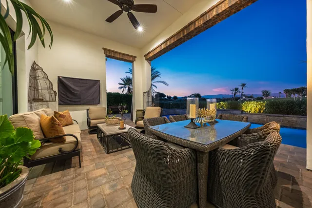 a view of a swimming pool and lounge chairs