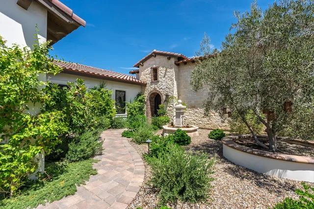a living room with dining room and wooden floor