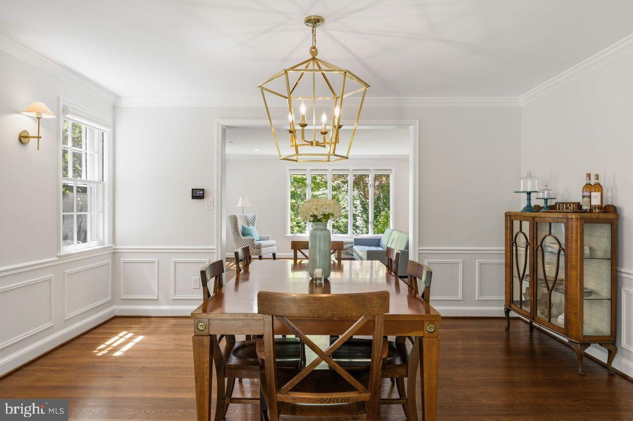 4555 W Street Northwest Washington, DC 20007 - Photo 13 of 34 a view of a dining room with furniture window and wooden floor