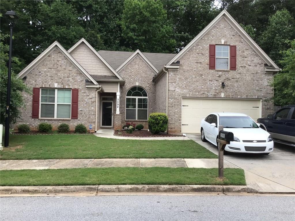 3592 Sycamore Bend Decatur, GA 30034 - Photo 1 of 1 a front view of a house with a yard
