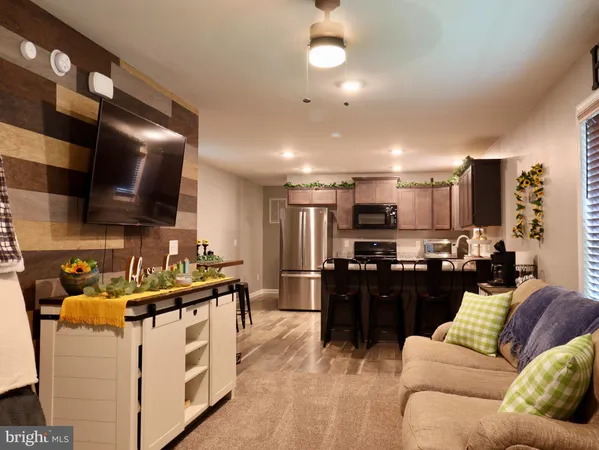a living room with furniture and a flat screen tv