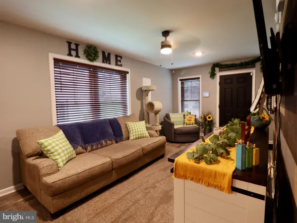 a living room with furniture and window