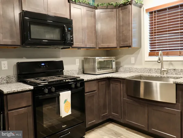 a kitchen with a table and chairs in it