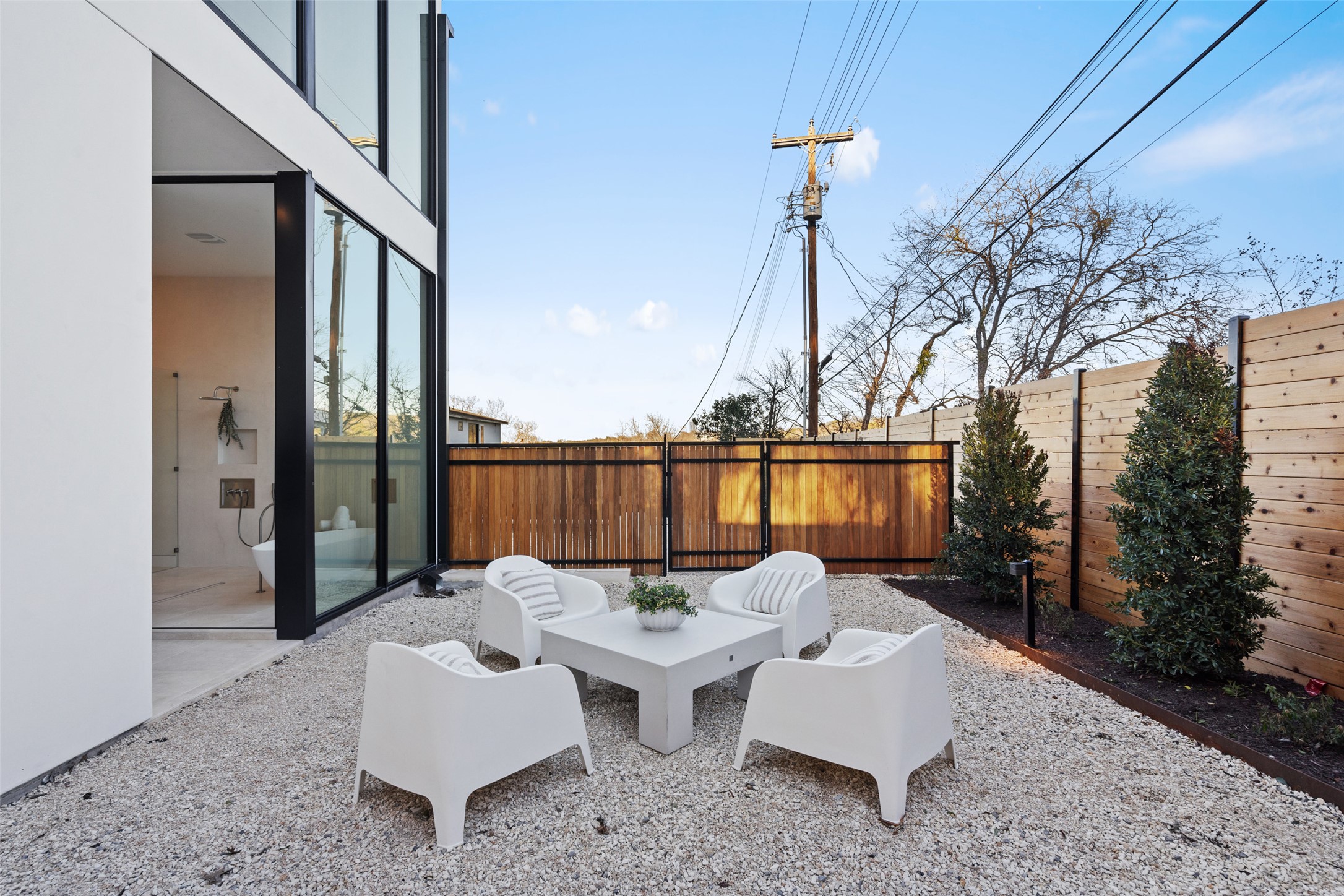 2605 Rockingham Drive Austin, TX 78704 - Photo 22 of 32 a patio with patio couch and iron fence