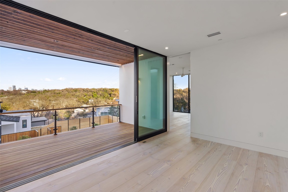 2605 Rockingham Drive Austin, TX 78704 - Photo 25 of 32 Upper level common area with full window sliding doors to deck.