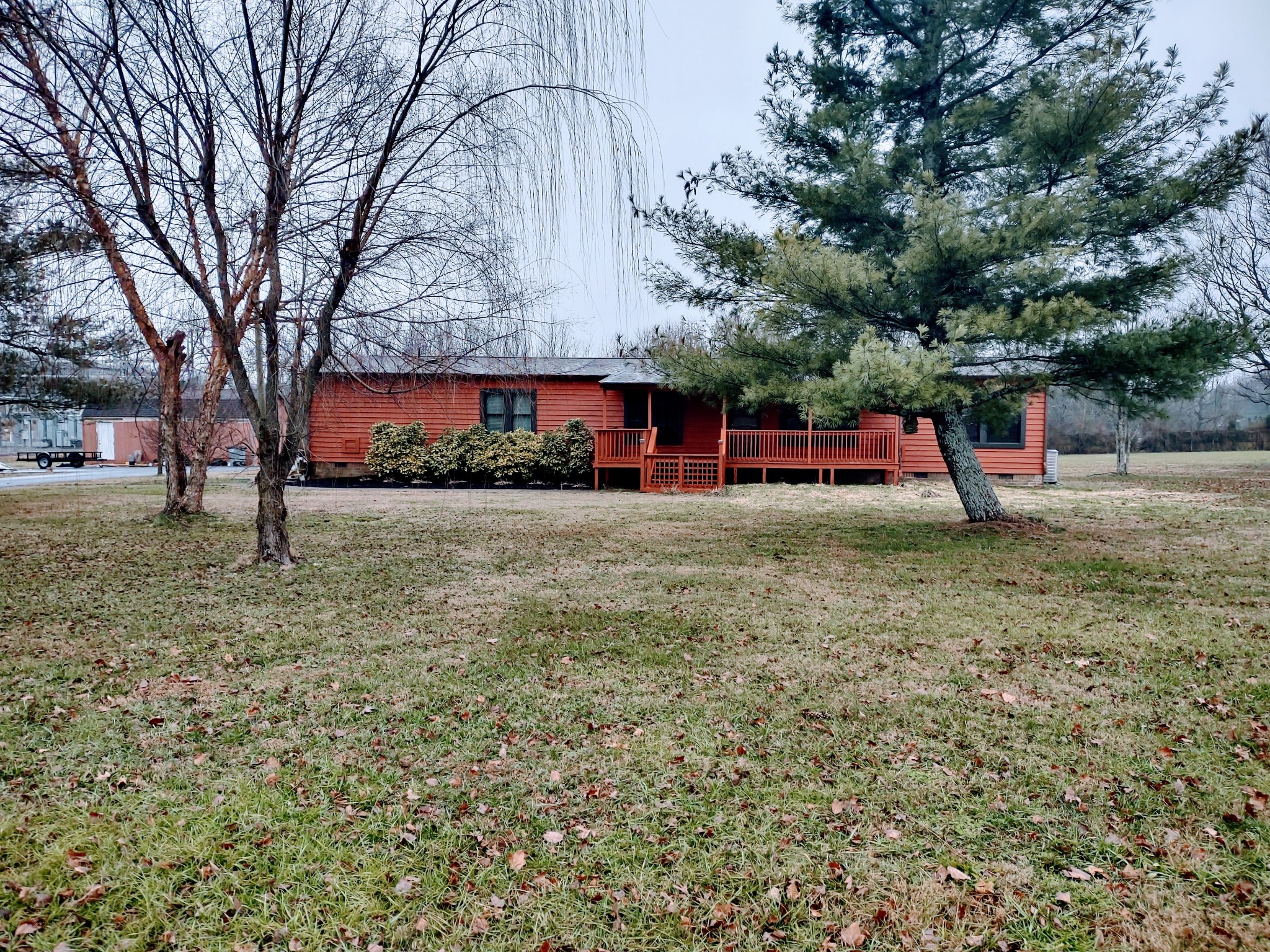 6841 Bethel Road Goodlettsville, TN 37072 - Photo 1 of 27 a view of a backyard with large trees