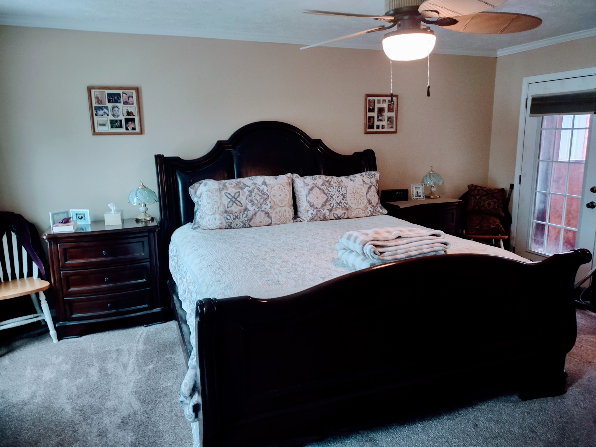 6841 Bethel Road Goodlettsville, TN 37072 - Photo 20 of 27 a bedroom with a bed and a chandelier