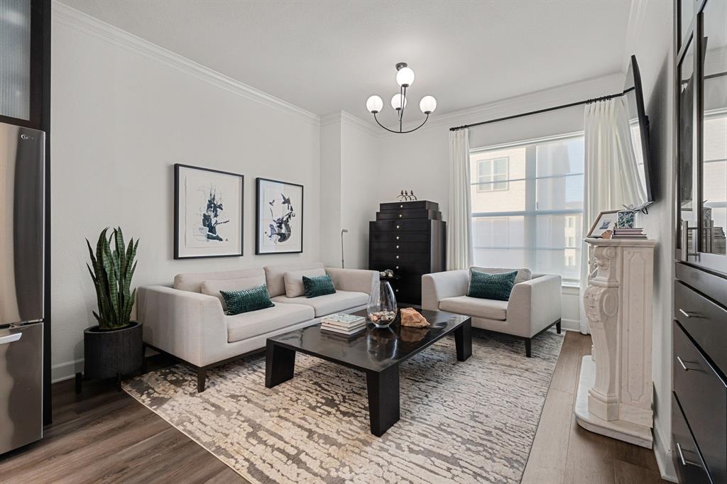 546 West Erwin Street Tyler, TX 75702 - Photo 15 of 29 a living room with furniture and a chandelier