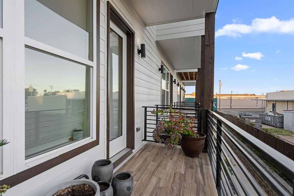546 West Erwin Street Tyler, TX 75702 - Photo 6 of 29 a view of a balcony with furniture and wooden floor