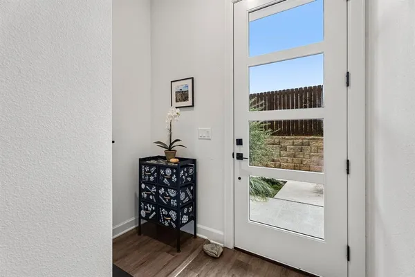 a view of entryway with wooden floor