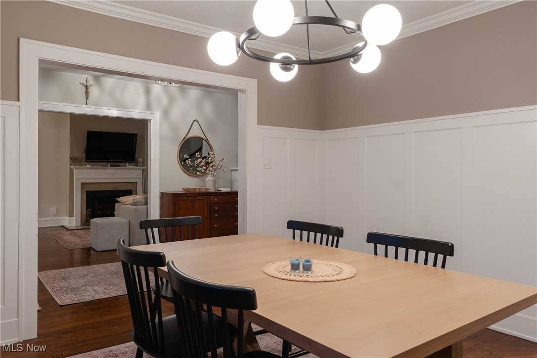 2890 Huntington Road Cleveland, OH 44120 - Photo 36 of 41 Dining room with ornamental molding, a chandelier, and dark hardwood / wood-style flooring
