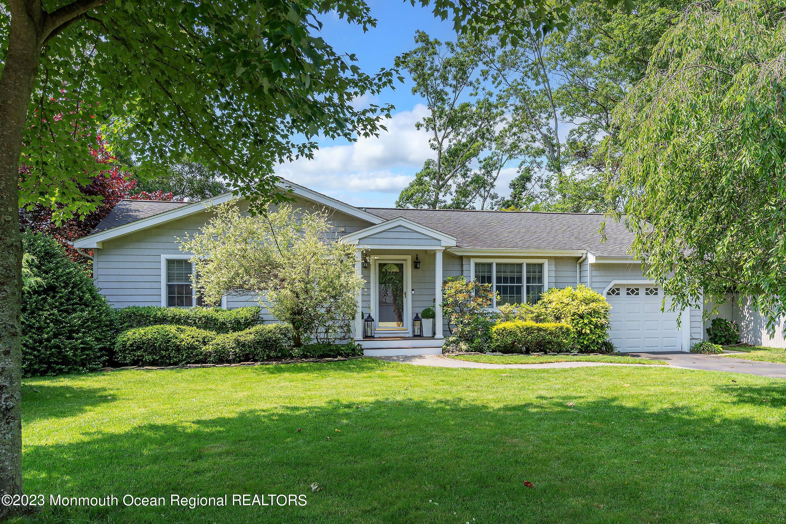 653 Carroll Fox Road Brick, NJ 08724 - Photo 29 of 48 a front view of a house with garden