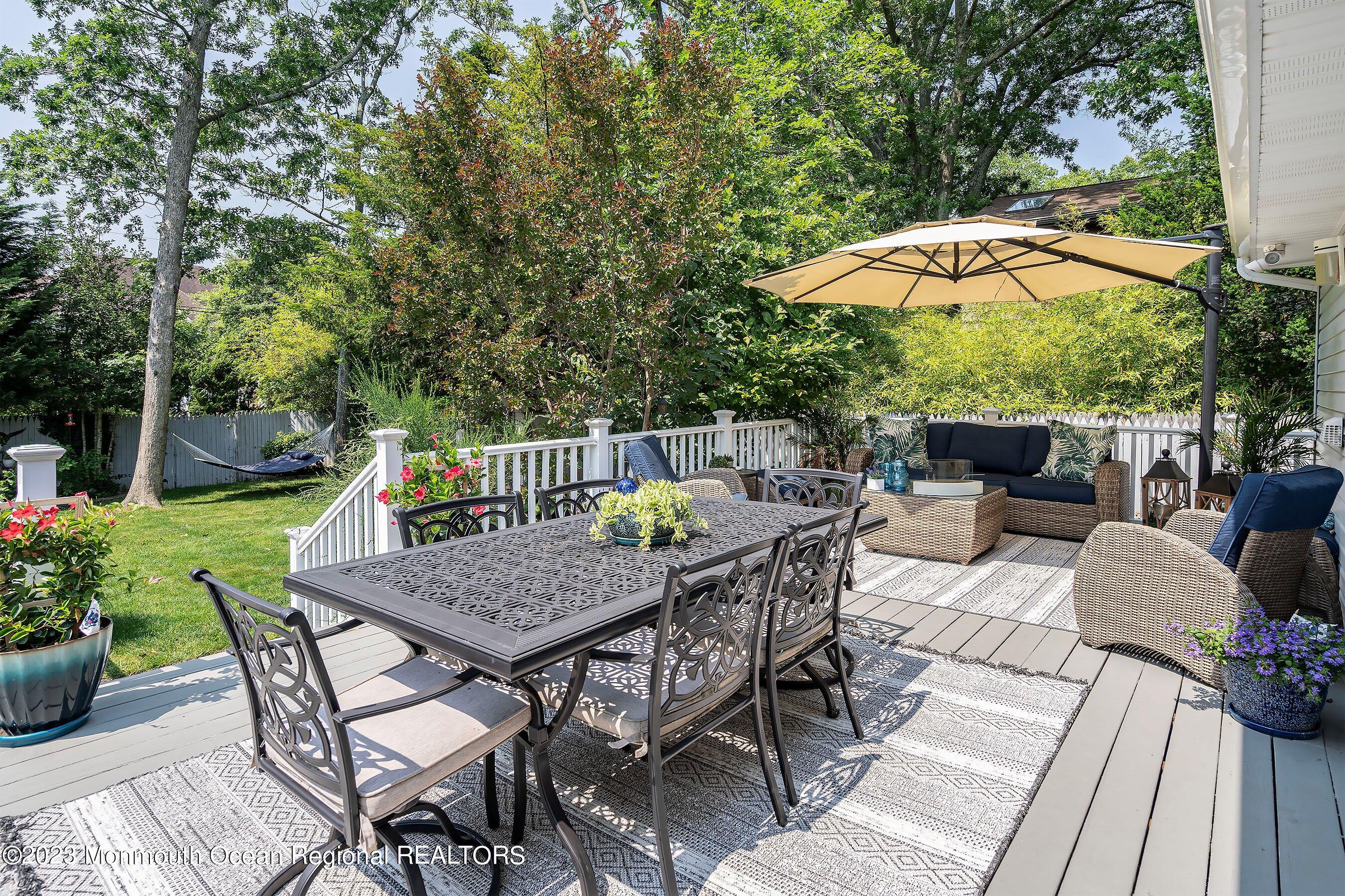 653 Carroll Fox Road Brick, NJ 08724 - Photo 3 of 48 a view of backyard with seating space and trees