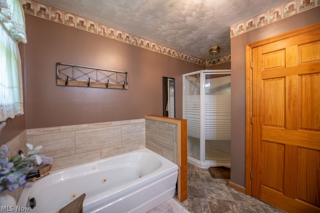 48800 Foxes Bottom Road Cadiz, OH 43907 - Photo 31 of 50 Full bathroom features a modern jetted bathtub and shower
