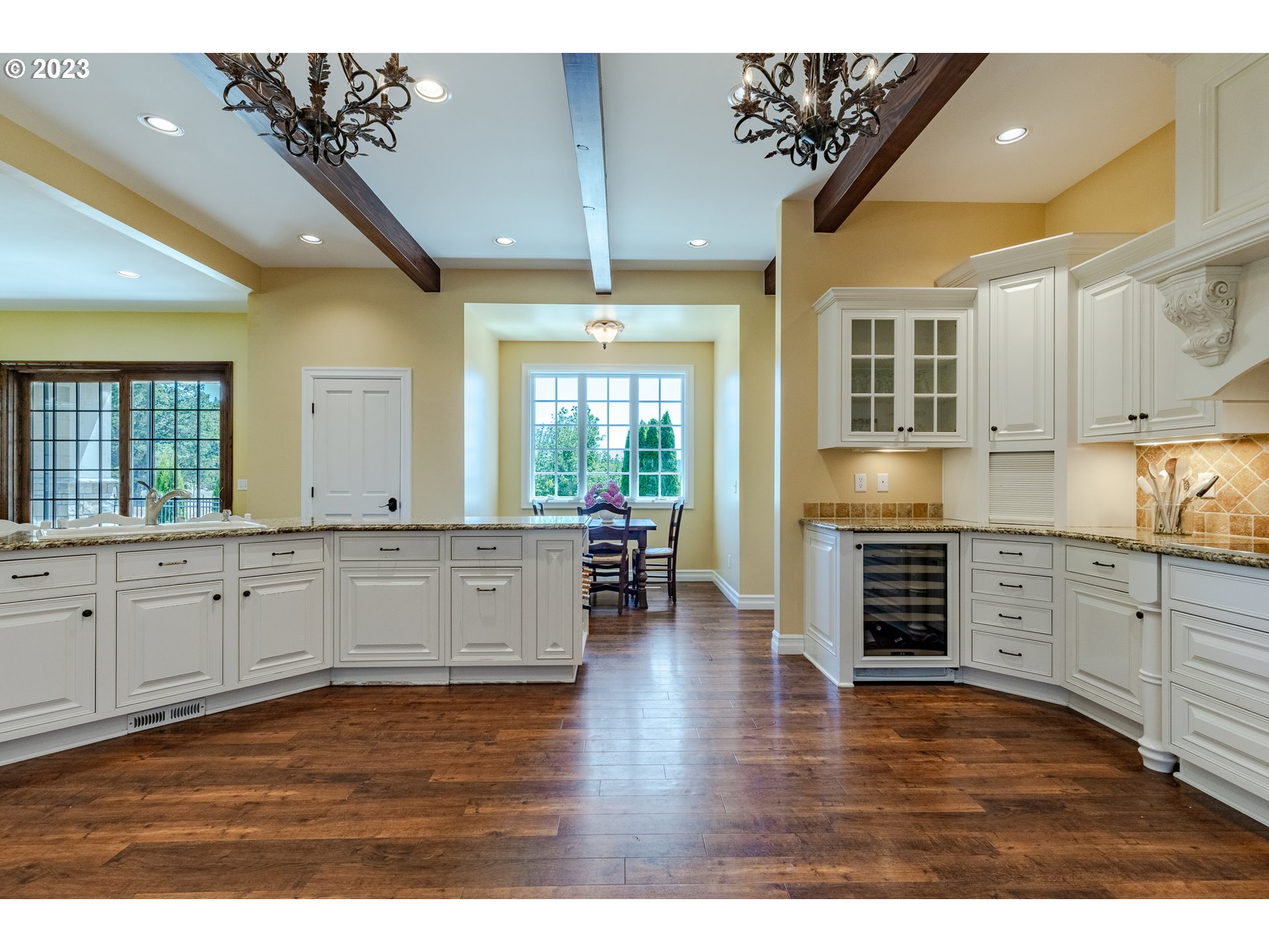 86705 Pine Grove Road Eugene, OR 97402 - Photo 21 of 48 a kitchen with stainless steel appliances granite countertop a stove a sink dishwasher and a microwave oven with white cabinets