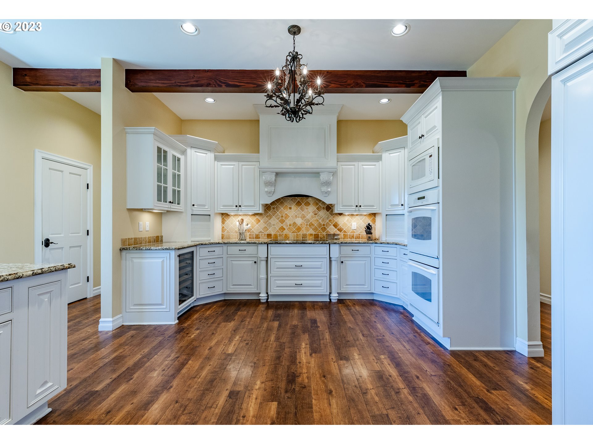 86705 Pine Grove Road Eugene, OR 97402 - Photo 24 of 48 a view of kitchen and dining room with wooden floor