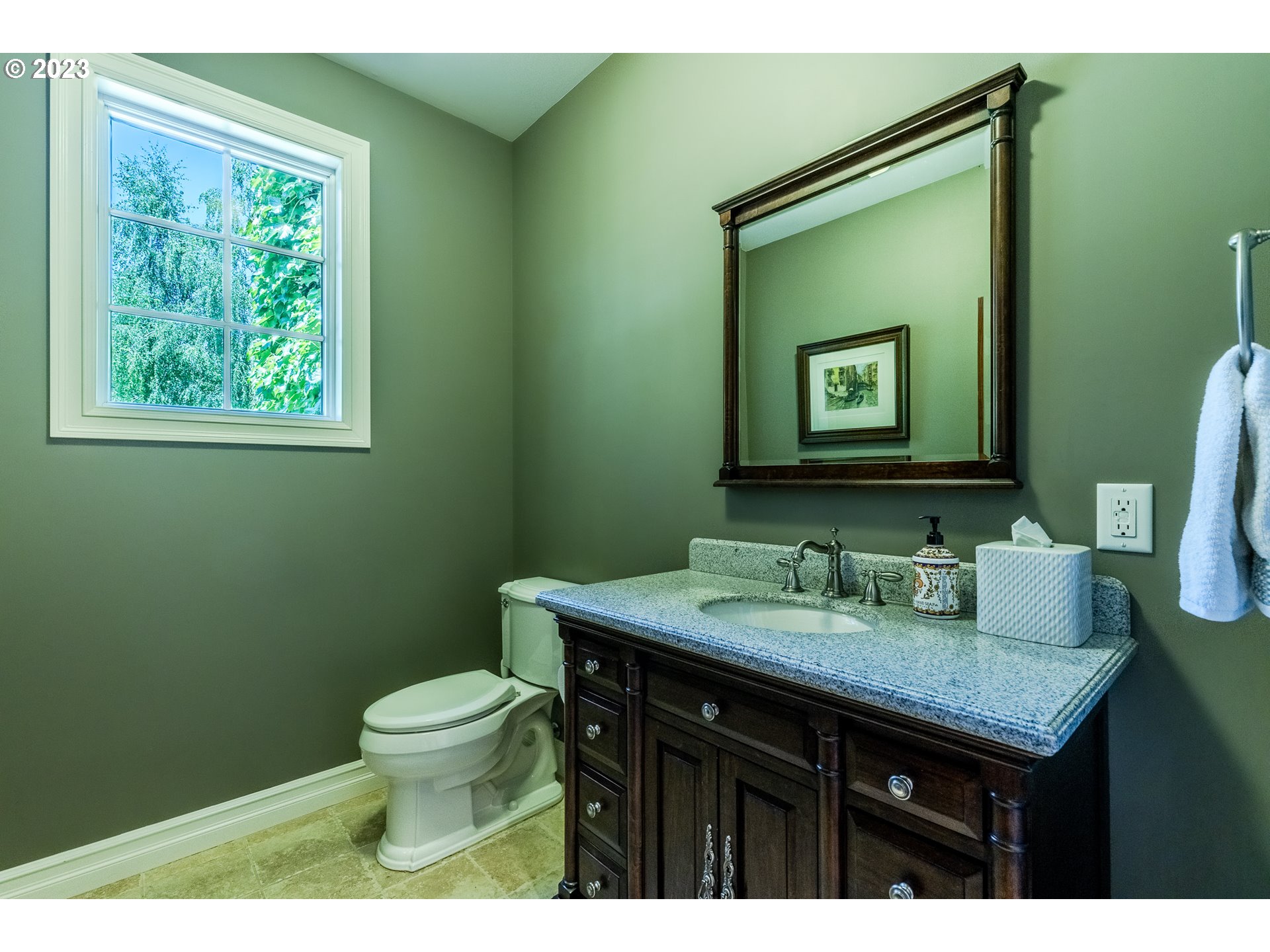 86705 Pine Grove Road Eugene, OR 97402 - Photo 30 of 48 a bathroom with a granite countertop toilet a sink and a mirror