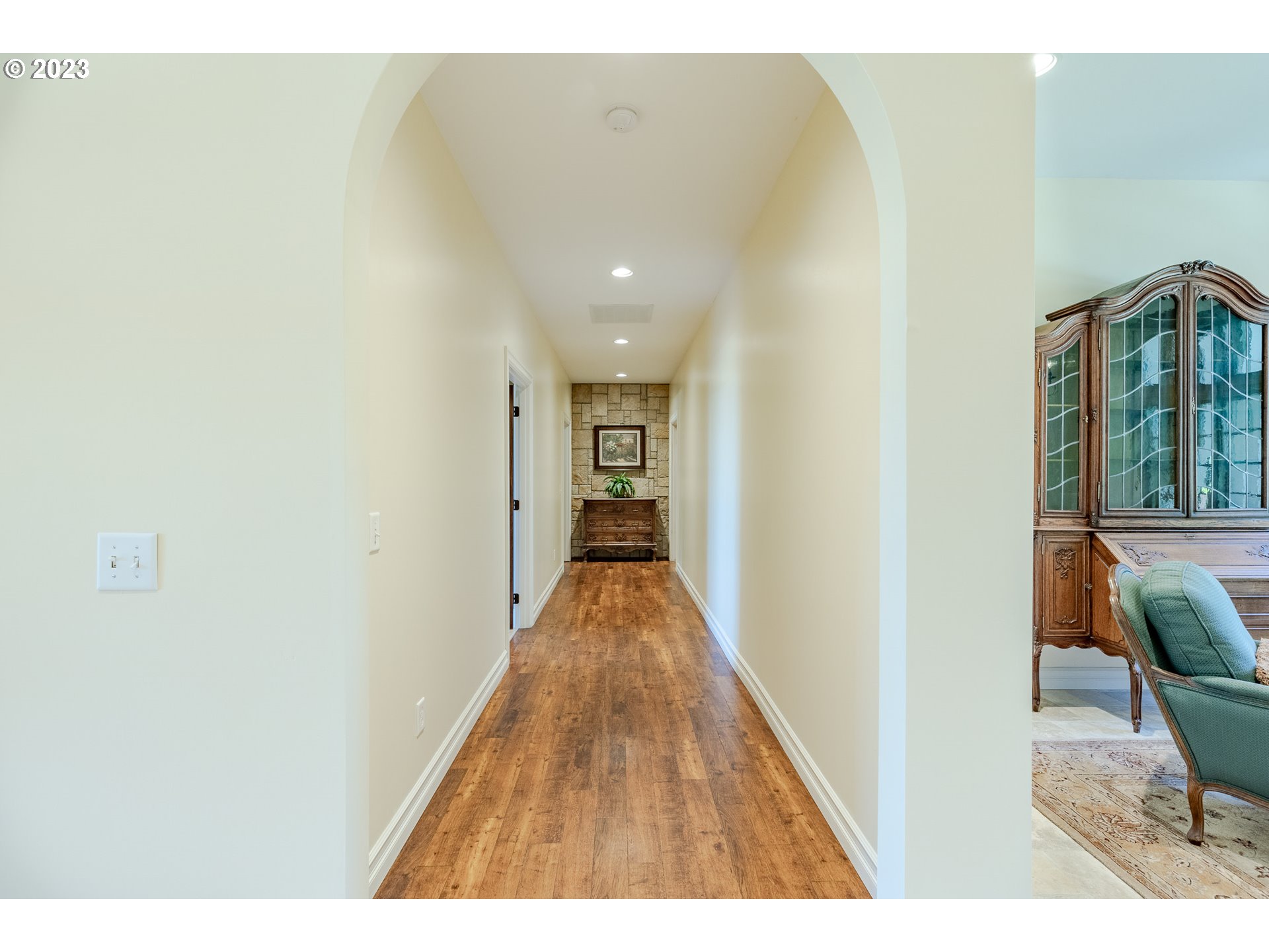 86705 Pine Grove Road Eugene, OR 97402 - Photo 37 of 48 a view of a hallway with wooden floor and staircase