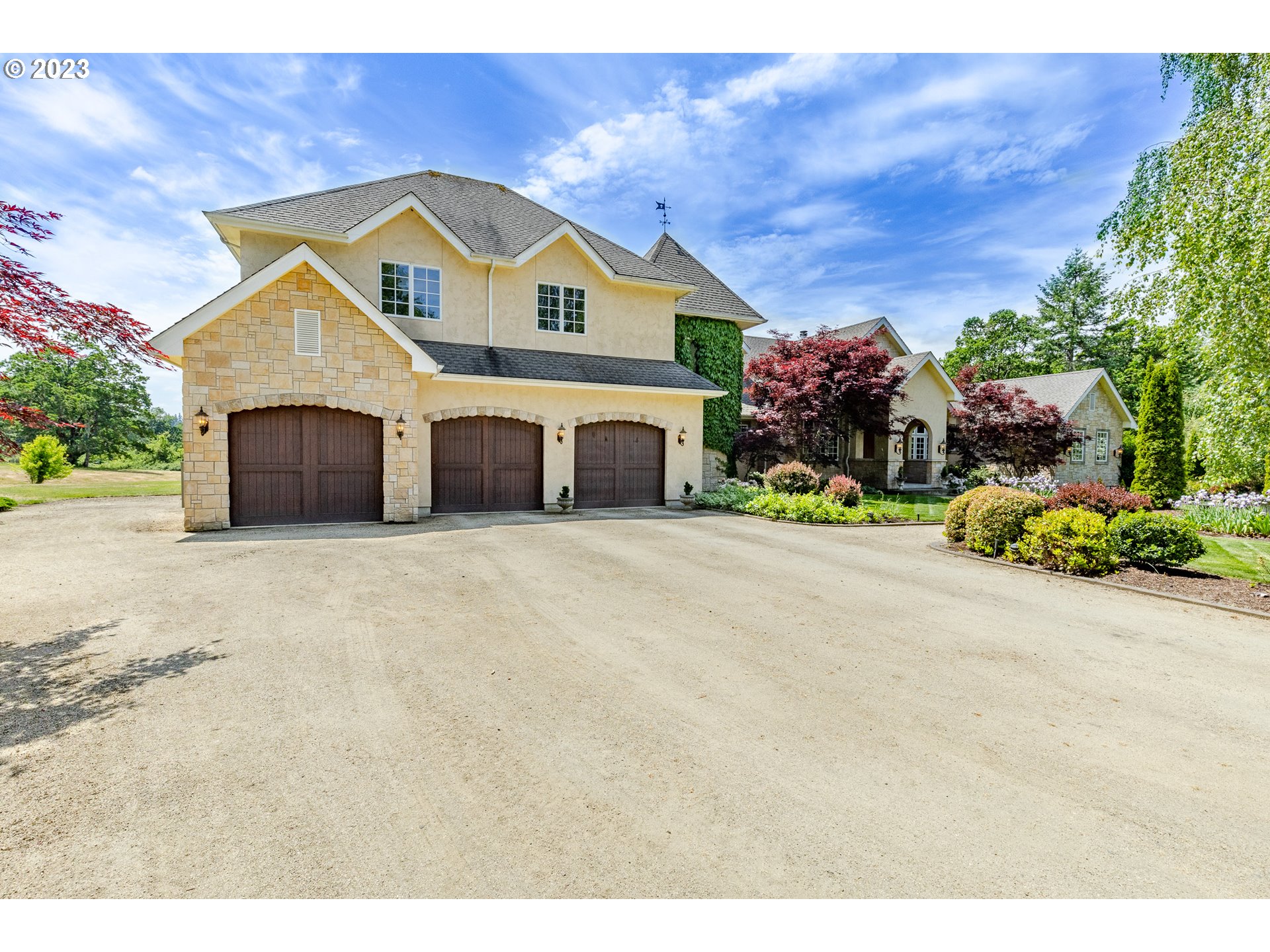 86705 Pine Grove Road Eugene, OR 97402 - Photo 5 of 48 a front view of a house with a yard and garage
