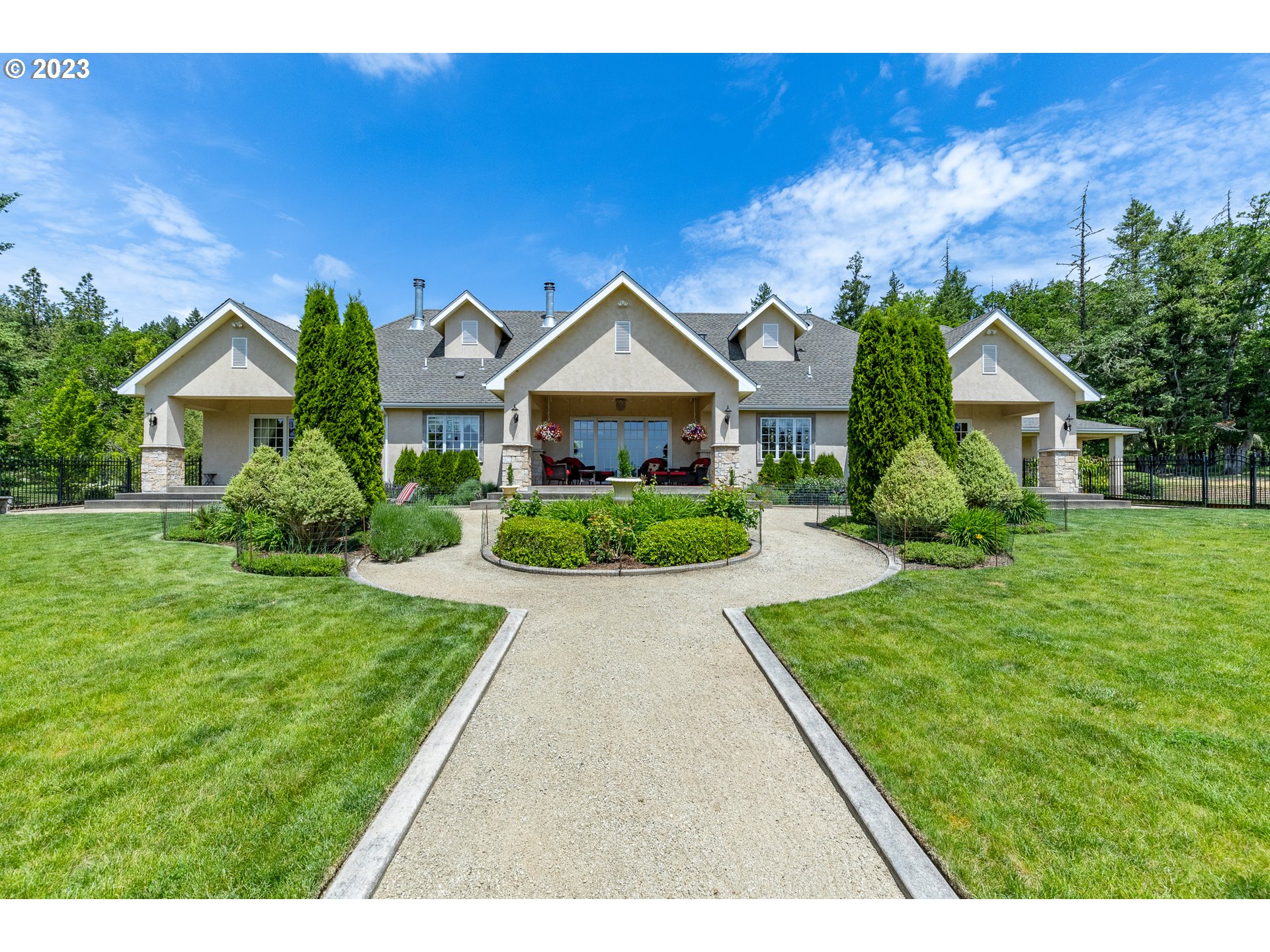 86705 Pine Grove Road Eugene, OR 97402 - Photo 6 of 48 a front view of a house with a garden