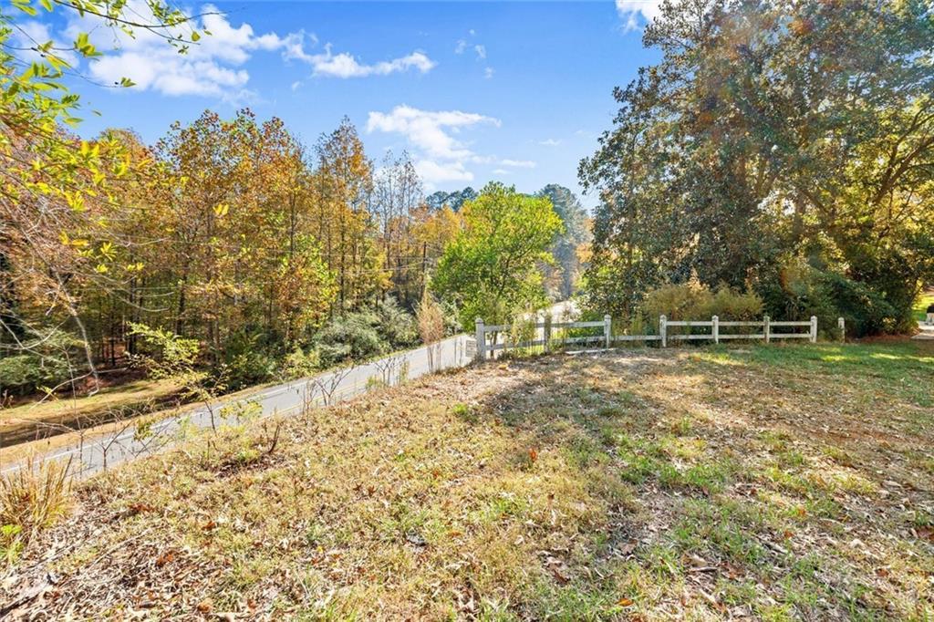 1099 Burnt Hickory Road Northwest Marietta, GA 30064 - Photo 14 of 17 a view of outdoor space with deck and trees