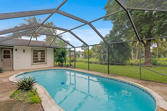 a view of swimming pool with a backyard