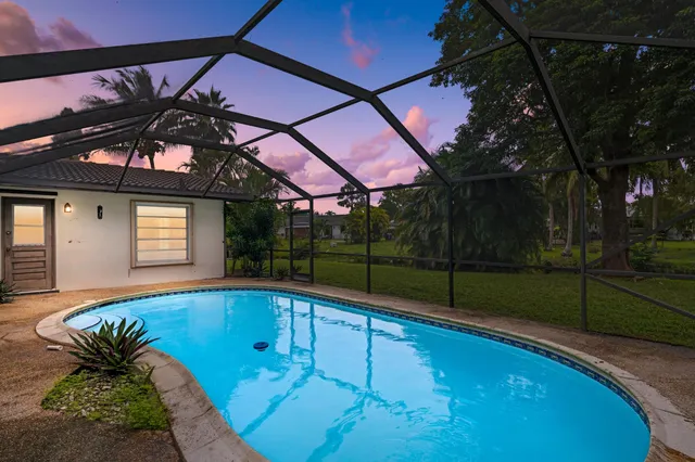 a view of a backyard with a small pool