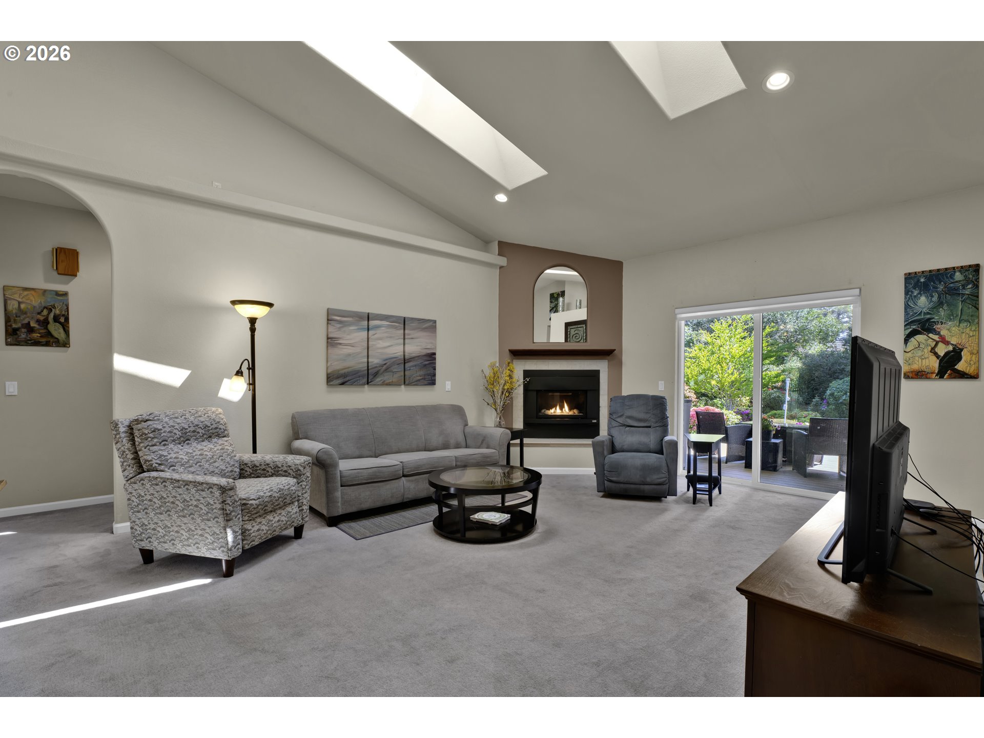 109 Ocean View Court Florence, OR 97439 - Photo 11 of 48 a living room with furniture flat screen tv and a fireplace