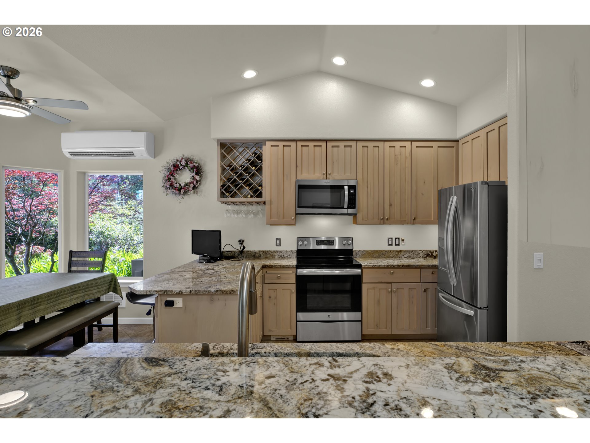 109 Ocean View Court Florence, OR 97439 - Photo 18 of 48 a kitchen with refrigerator and microwave
