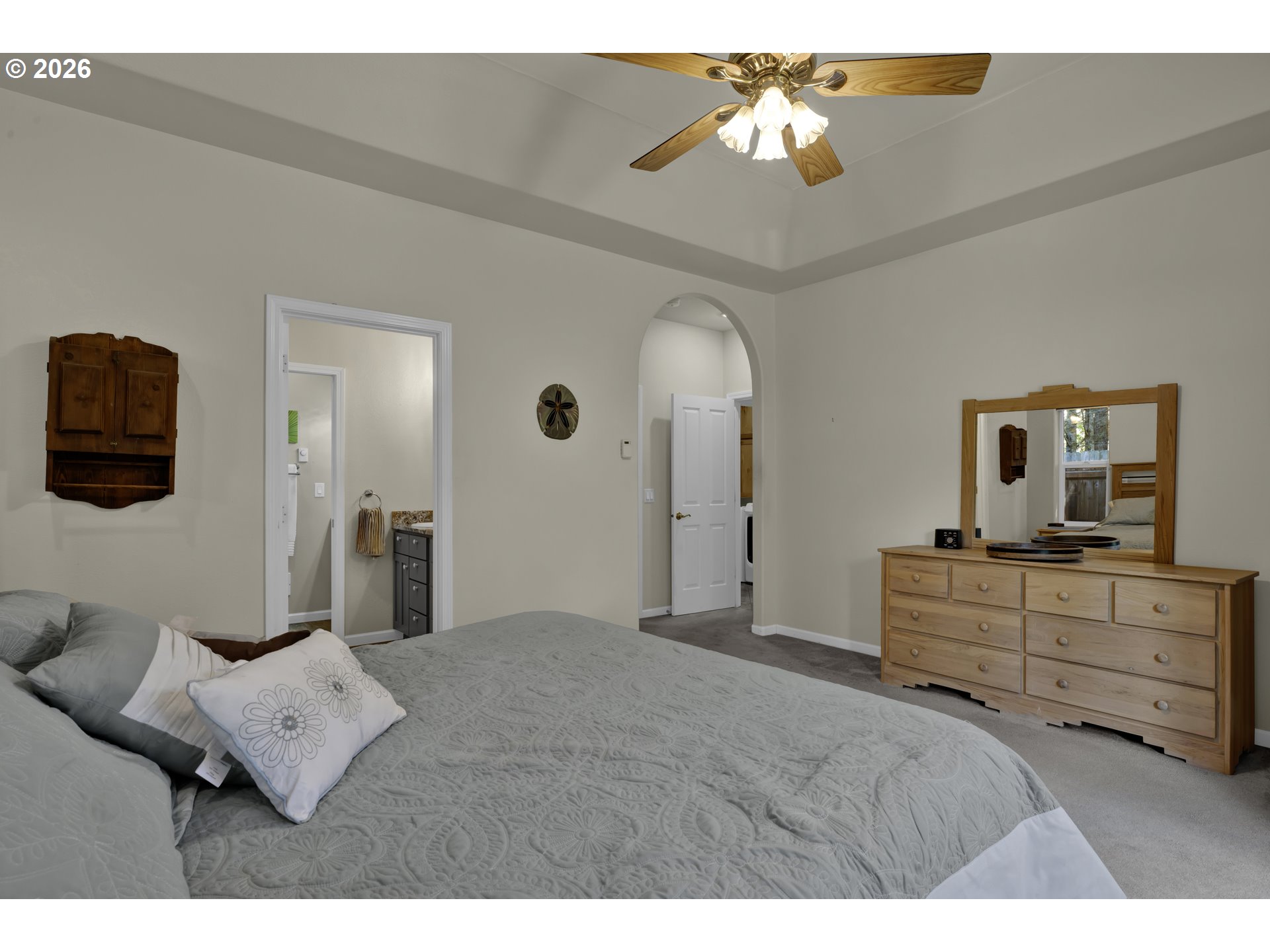 109 Ocean View Court Florence, OR 97439 - Photo 22 of 48 a bedroom with a bed and a chandelier