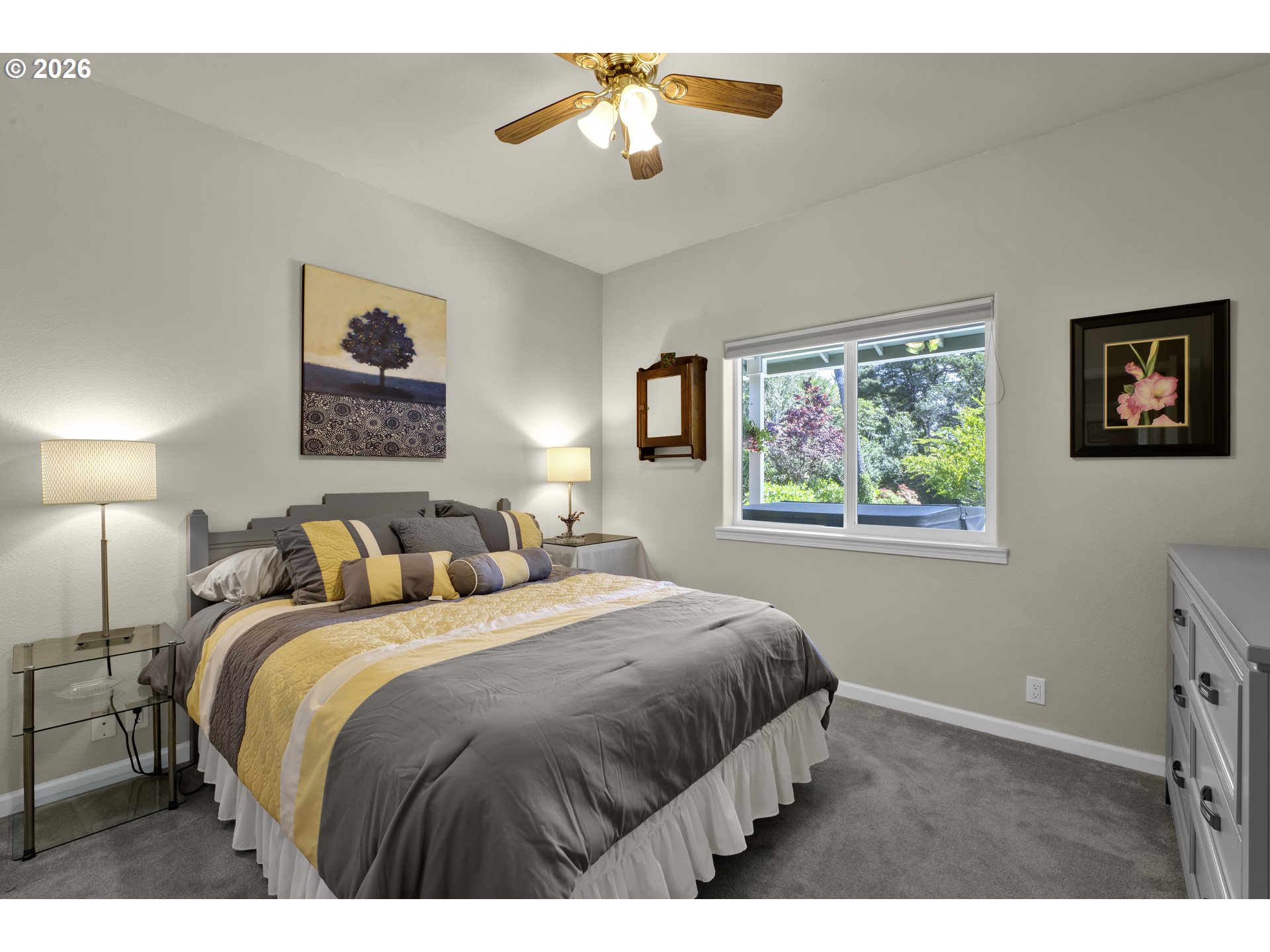 109 Ocean View Court Florence, OR 97439 - Photo 32 of 48 a bedroom with a bed and a chandelier