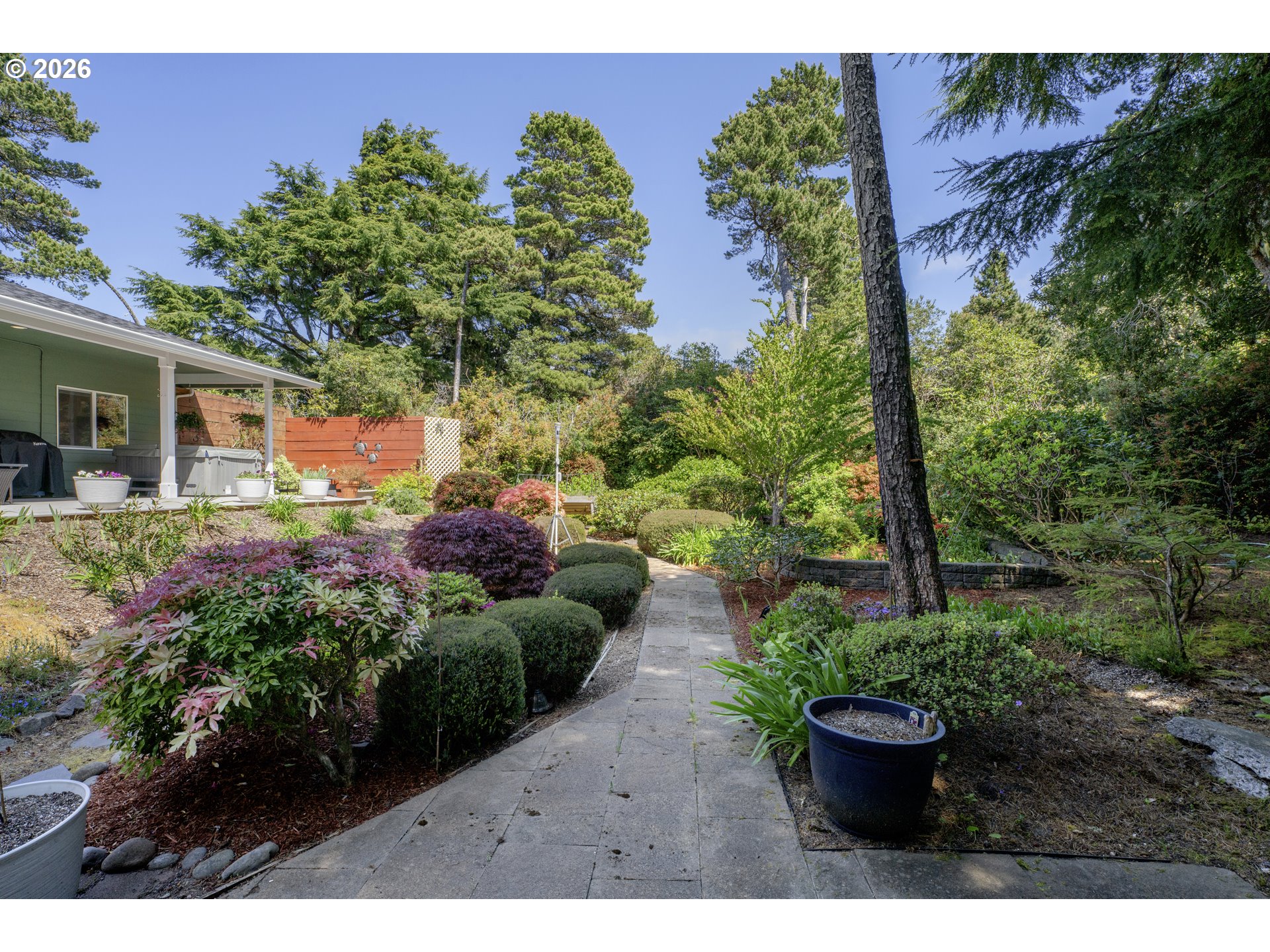 109 Ocean View Court Florence, OR 97439 - Photo 37 of 48 a view of a backyard with plants and a garden