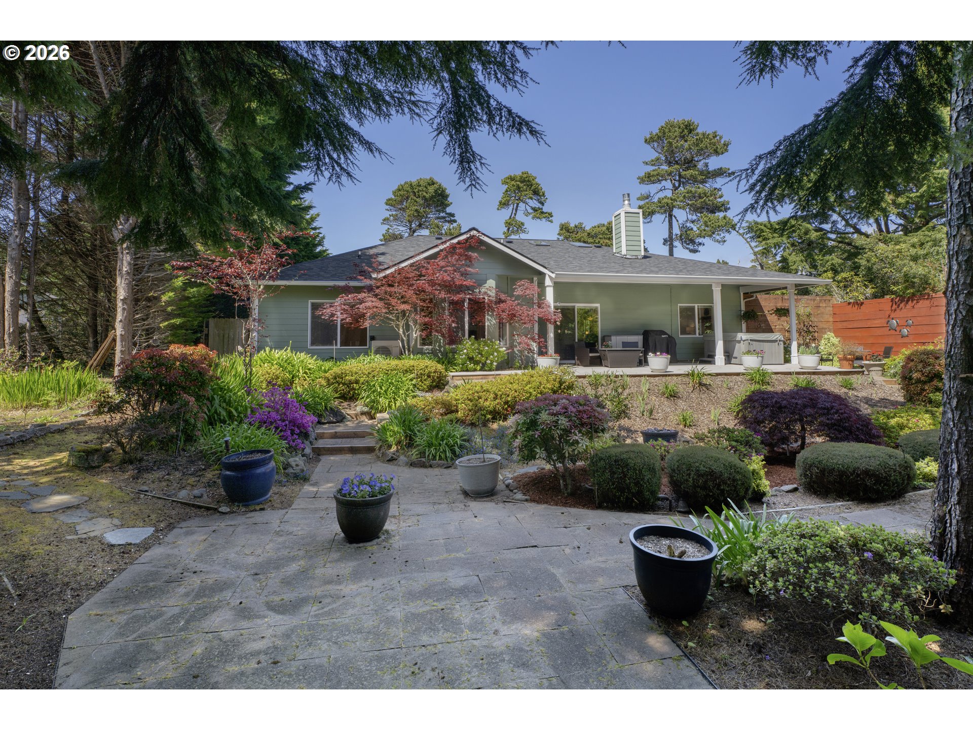 109 Ocean View Court Florence, OR 97439 - Photo 39 of 48 a view of a garden with a patio