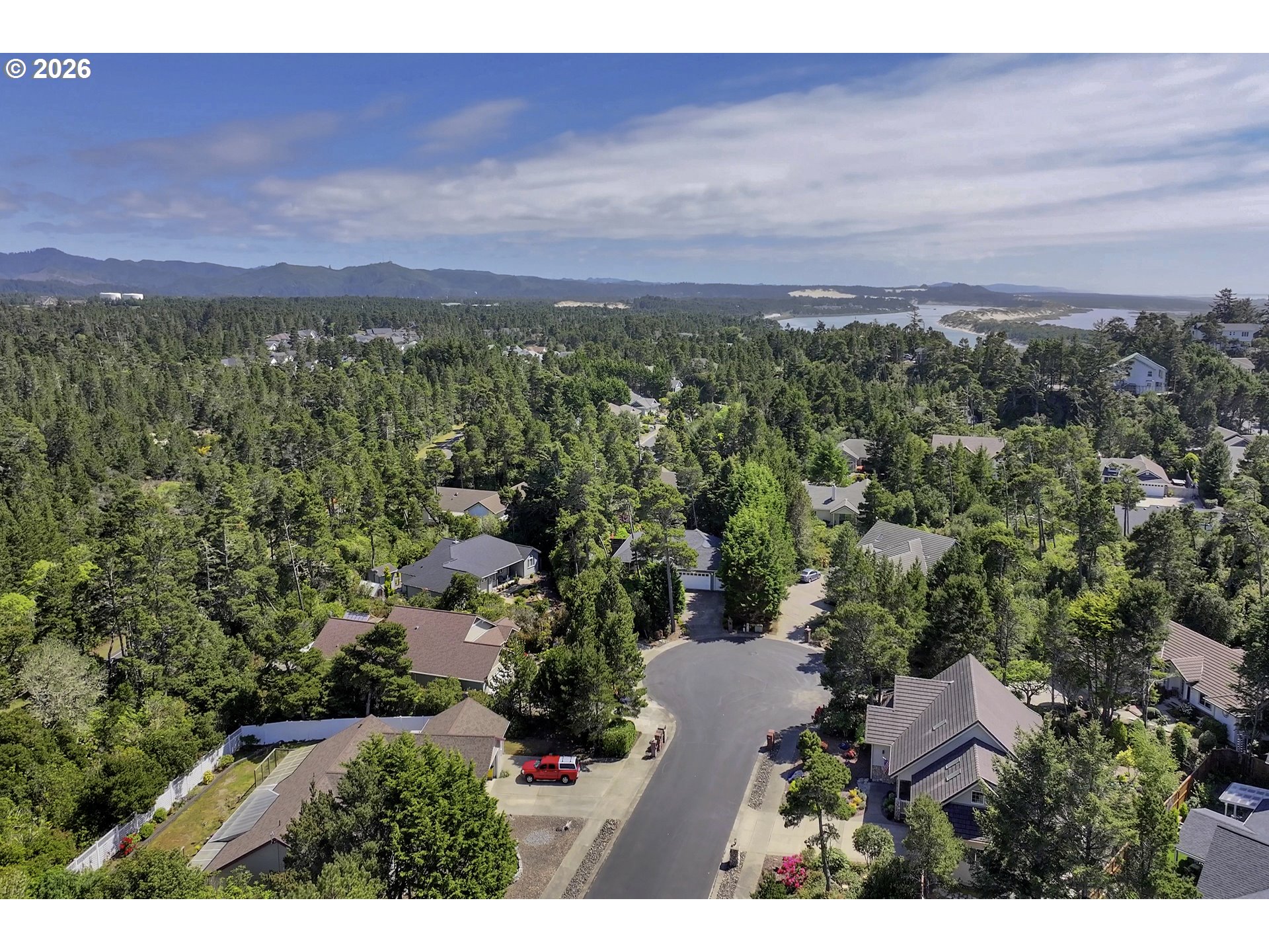 109 Ocean View Court Florence, OR 97439 - Photo 44 of 48 a view of a city with sunset
