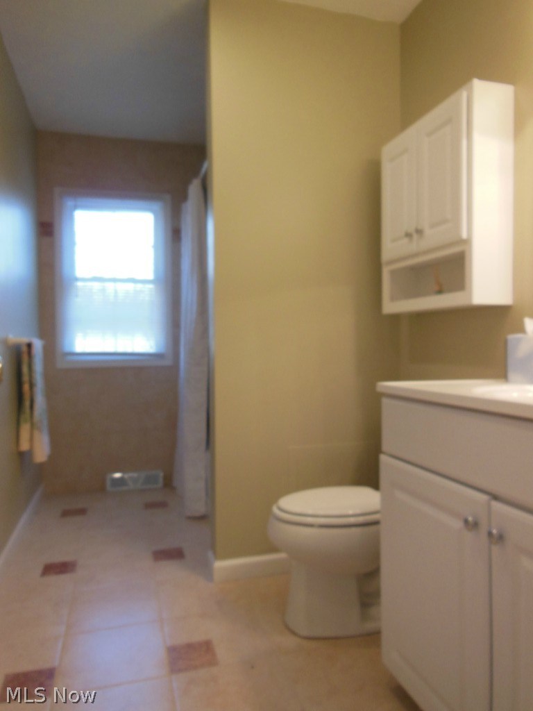 12145 Sperry Road Chesterland, OH 44026 - Photo 17 of 22 Second Full Bath for the Additional Three Bedrooms ... Ceramic Tile Flooring and Bath/Shower Area, Vanity, Storage Cabinets .... Very Spacious!