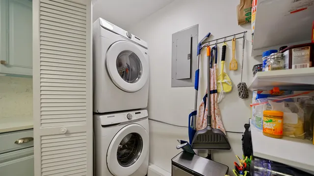 a view of a storage and utility room with washer and dryer