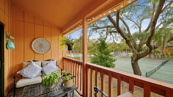 a view of a two chairs in the balcony