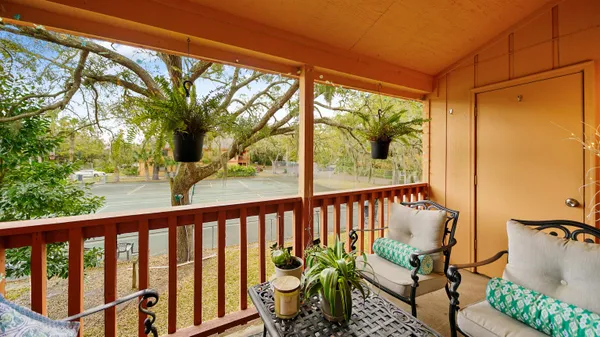 a view of balcony with furniture