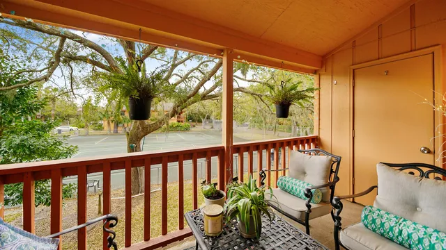 a view of balcony with furniture