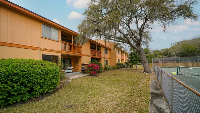 a view of a building with a garden
