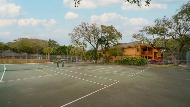 a view of an outdoor space and tennis court
