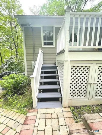 a view of a backyard with chairs