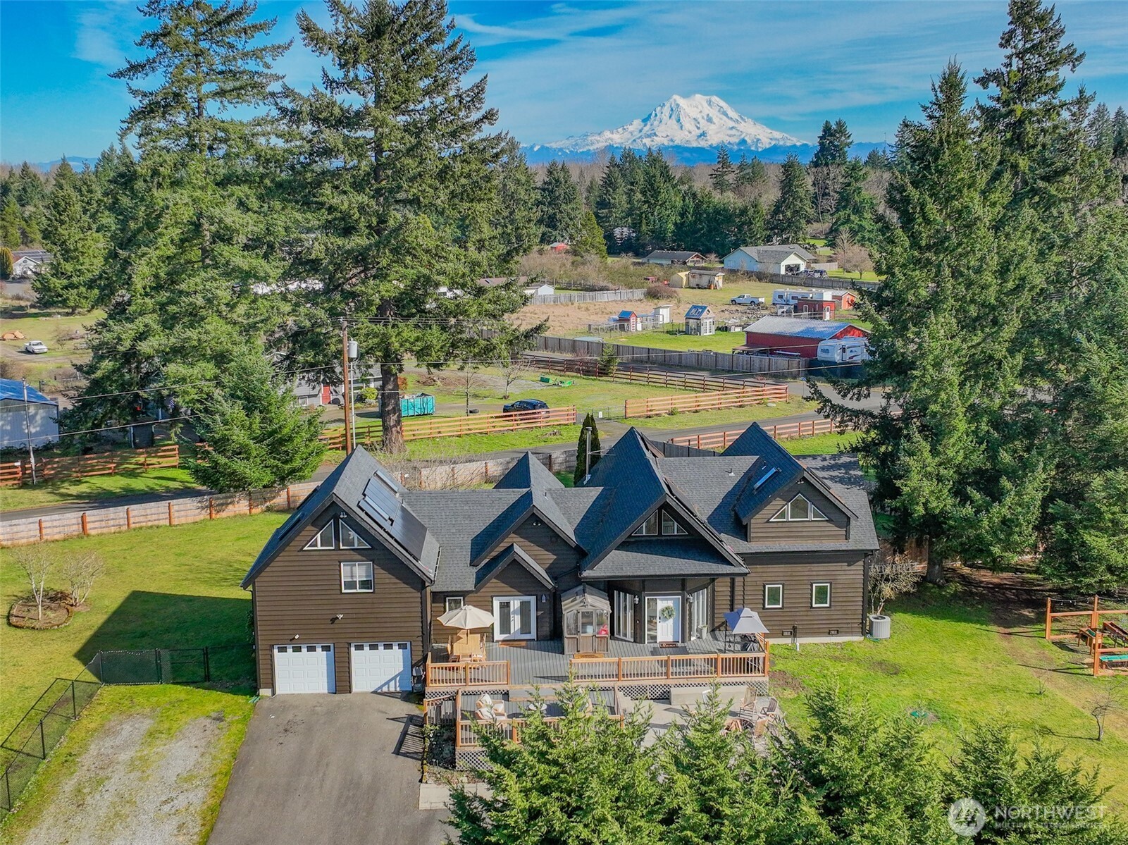9405 Bridge Road Southeast Yelm, WA 98597 - Photo 34 of 37 an aerial view of a house with swimming pool and garden